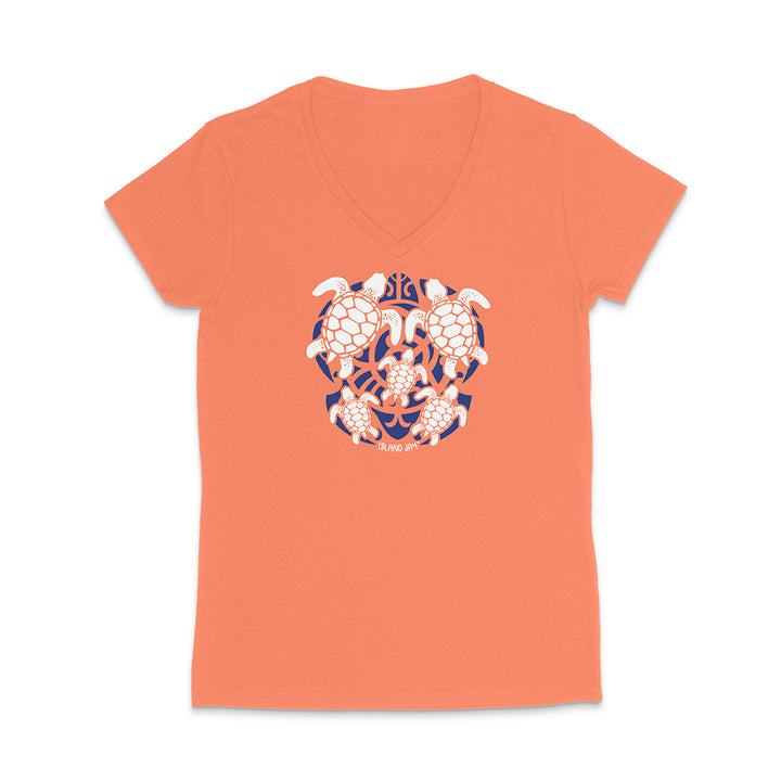 Coral t-shirt with a turtle design on a white background