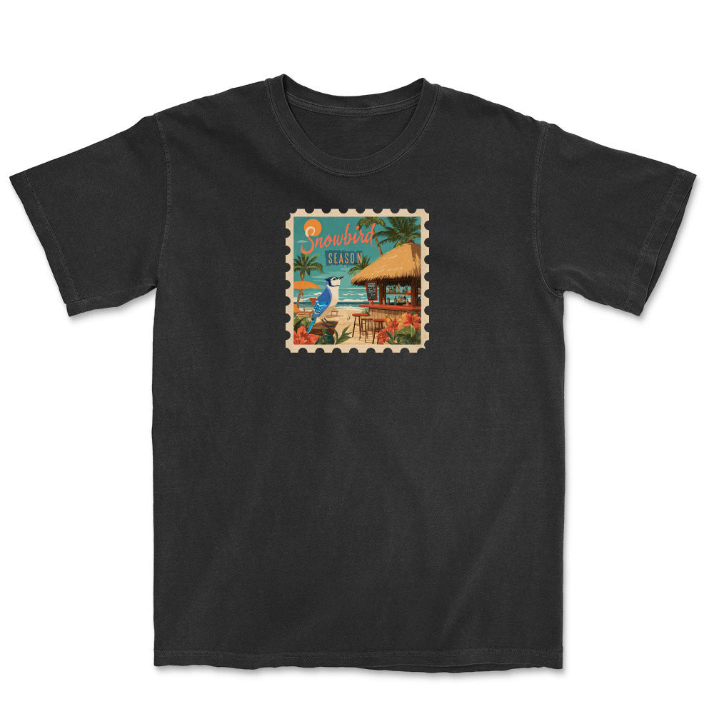 Black t-shirt with a colorful graphic of a tropical scene