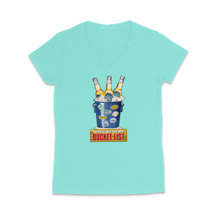 Mint green t-shirt with a graphic of a beer bucket with graphic text reading 'Working on my Bucket List' on a white background.