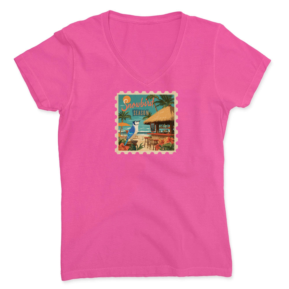 Pink t-shirt with a tropical graphic on a white background