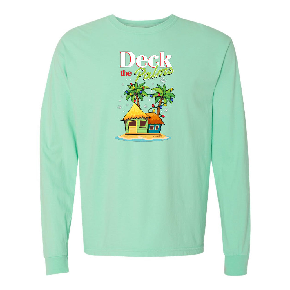 Mint green long-sleeve shirt with a tropical hut and palm tree design and graphic text reading "Deck The Palms" on a white background