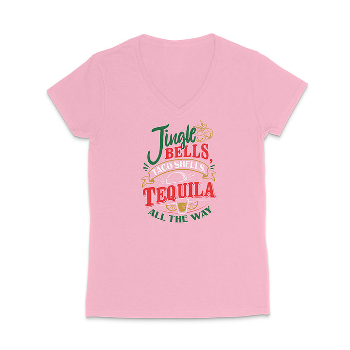 Pink t-shirt with colorful text design reading "Jingle Bells Taco Shells Tequila All The Way" on a white background