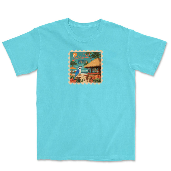Light blue t-shirt with a tropical graphic on a white background