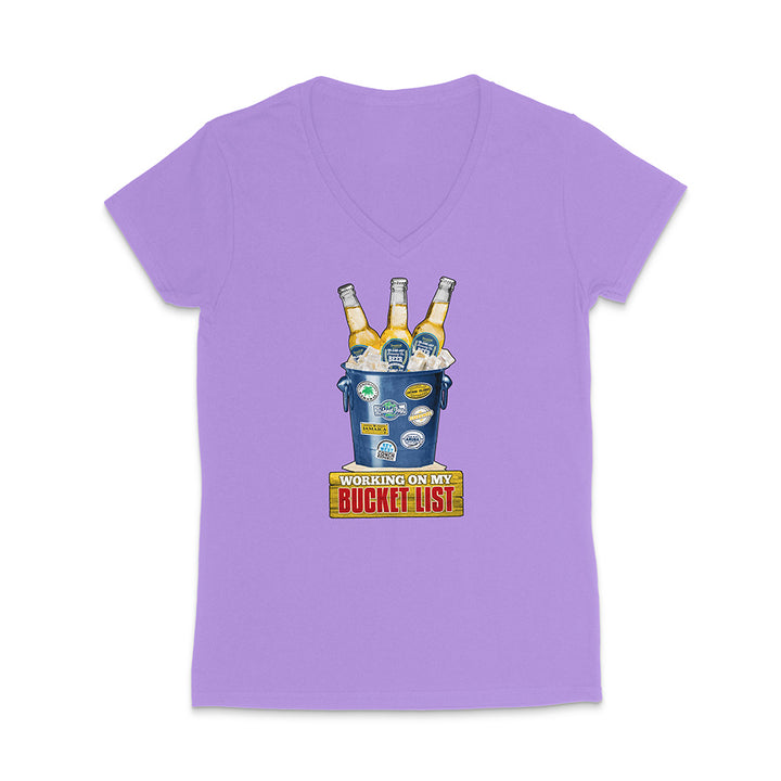 Purple t-shirt with a graphic of a beer bucket with graphic text reading 'Working on my Bucket List' on a white background.