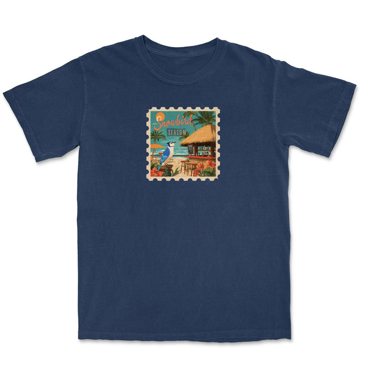 Navy blue t-shirt with a tropical island graphic on a white background