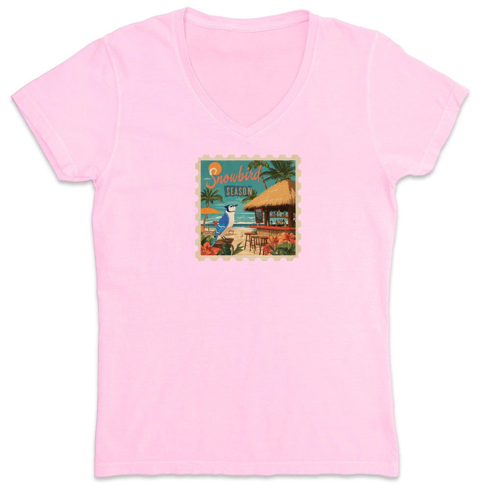 Pink t-shirt with a tropical graphic on a white background