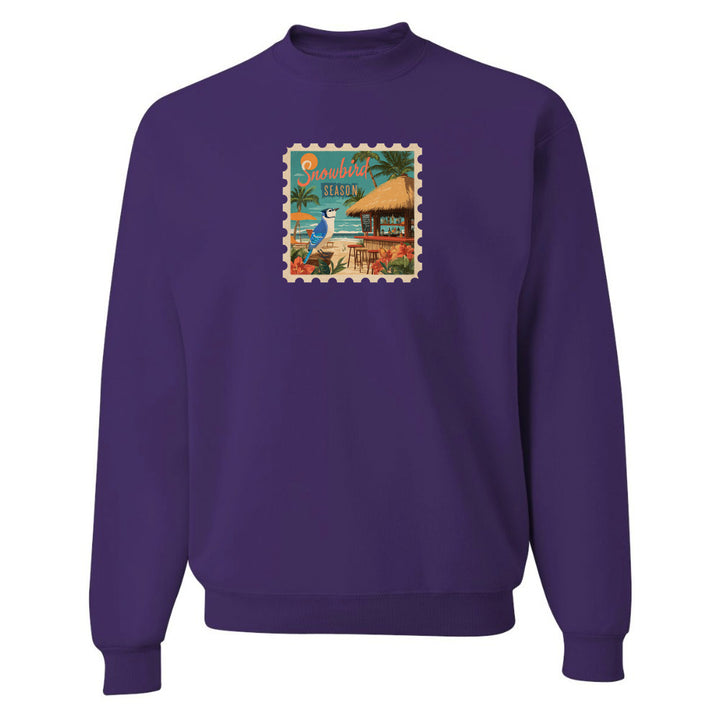 Purple sweatshirt with a colorful graphic on a white background