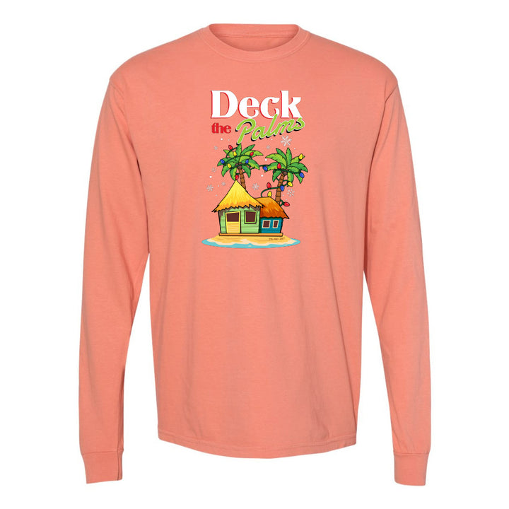 Peach long-sleeve shirt with a tropical hut and palm tree design and graphic text reading "Deck The Palms" on a white background