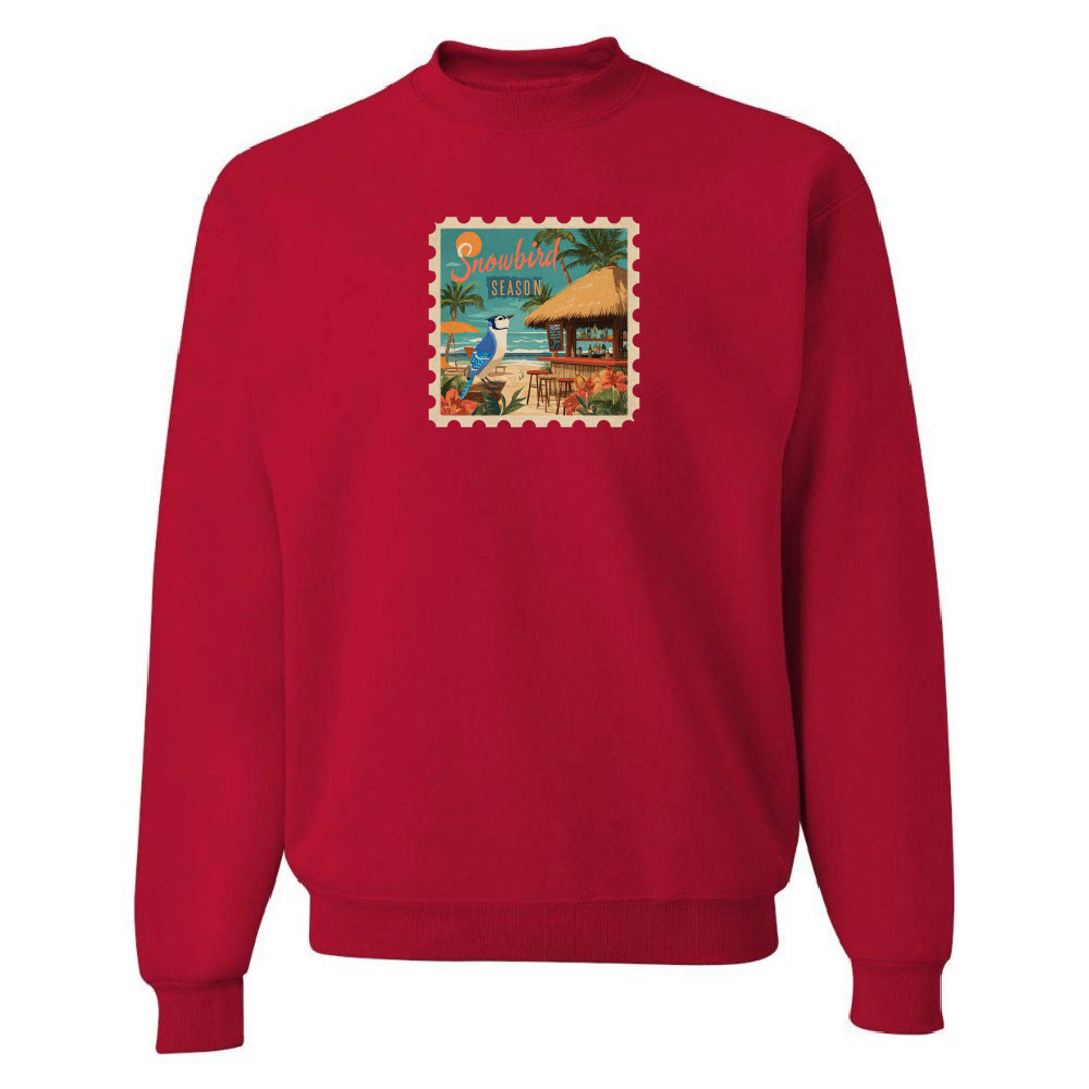 Red sweatshirt with a colorful graphic on a white background