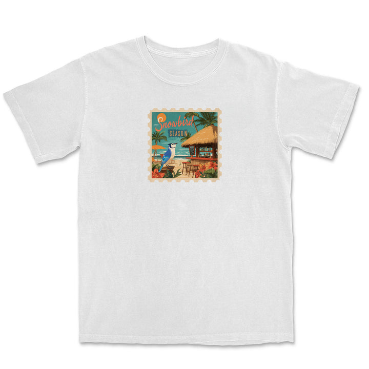 White t-shirt with a tropical island graphic on a white background