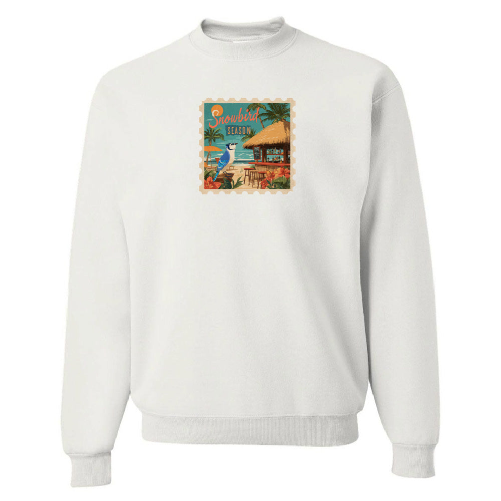 White sweatshirt with a colorful graphic on the chest against a white background
