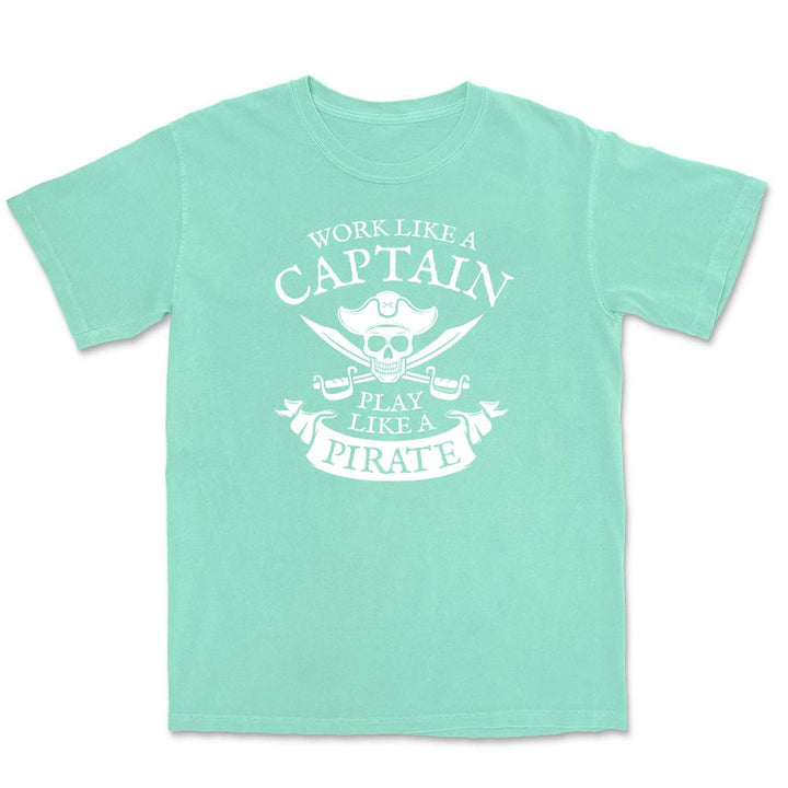 Mint green t-shirt with white text and skull design on a white background