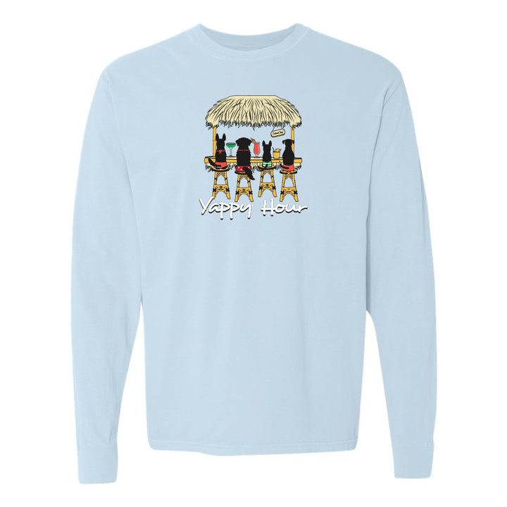 Light blue sweatshirt with a graphic of dogs at a beach hut and 'Yappy Hour' text on a white background.