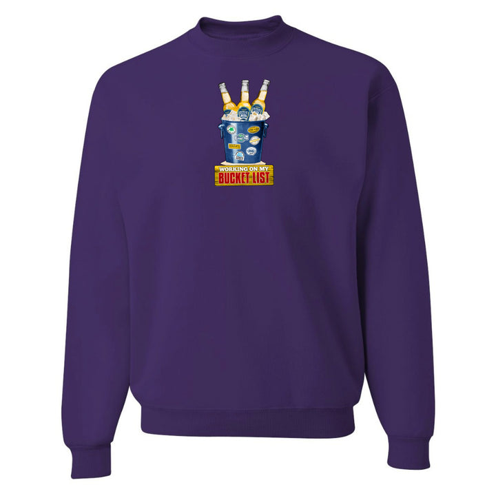 Purple sweatshirt with a colorful graphic design on a white background