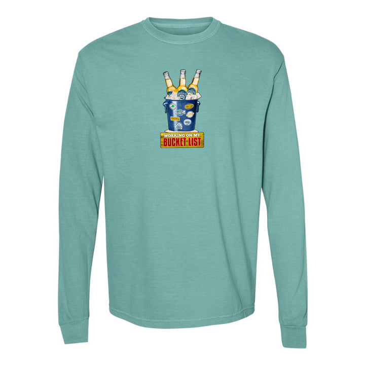 Teal long-sleeve shirt with a graphic design on a white background