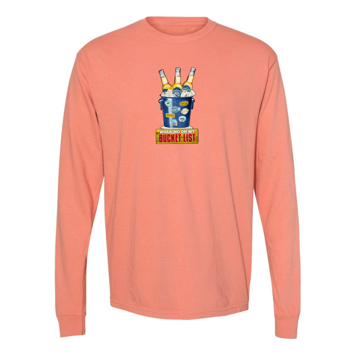 Peach long-sleeve shirt with a graphic design on a white background
