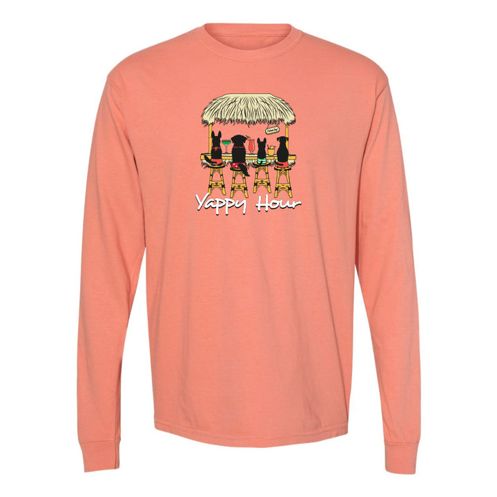 Coral long-sleeve shirt with a graphic of three dogs under an umbrella and 'Yappy Hour' text on a white background.