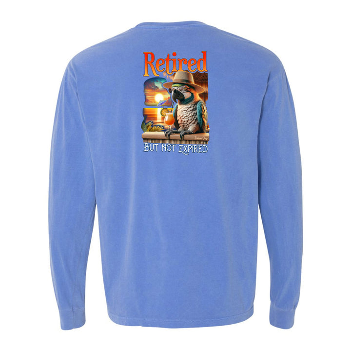 Blue long-sleeve shirt with a parrot graphic and text on the back