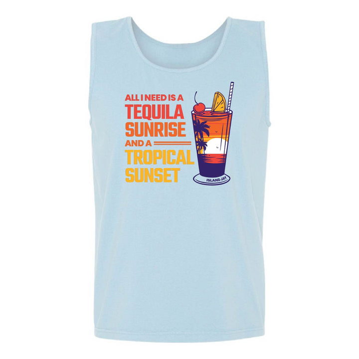 A light blue sleeveless tank top featuring a colorful graphic print on the front with the text 'ALL I NEED IS A TEQUILA SUNRISE AND A TROPICAL SUNSET' and an illustration of a cocktail glass.