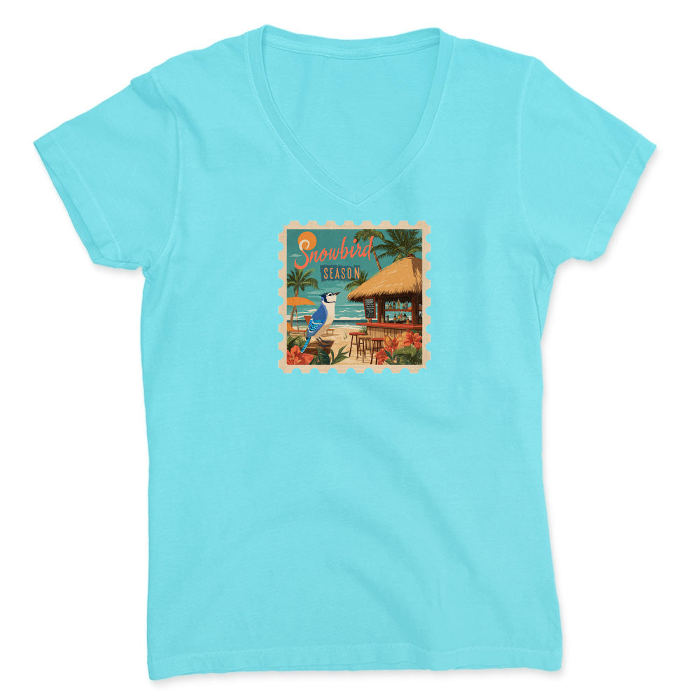 Light blue t-shirt with a tropical graphic on a white background