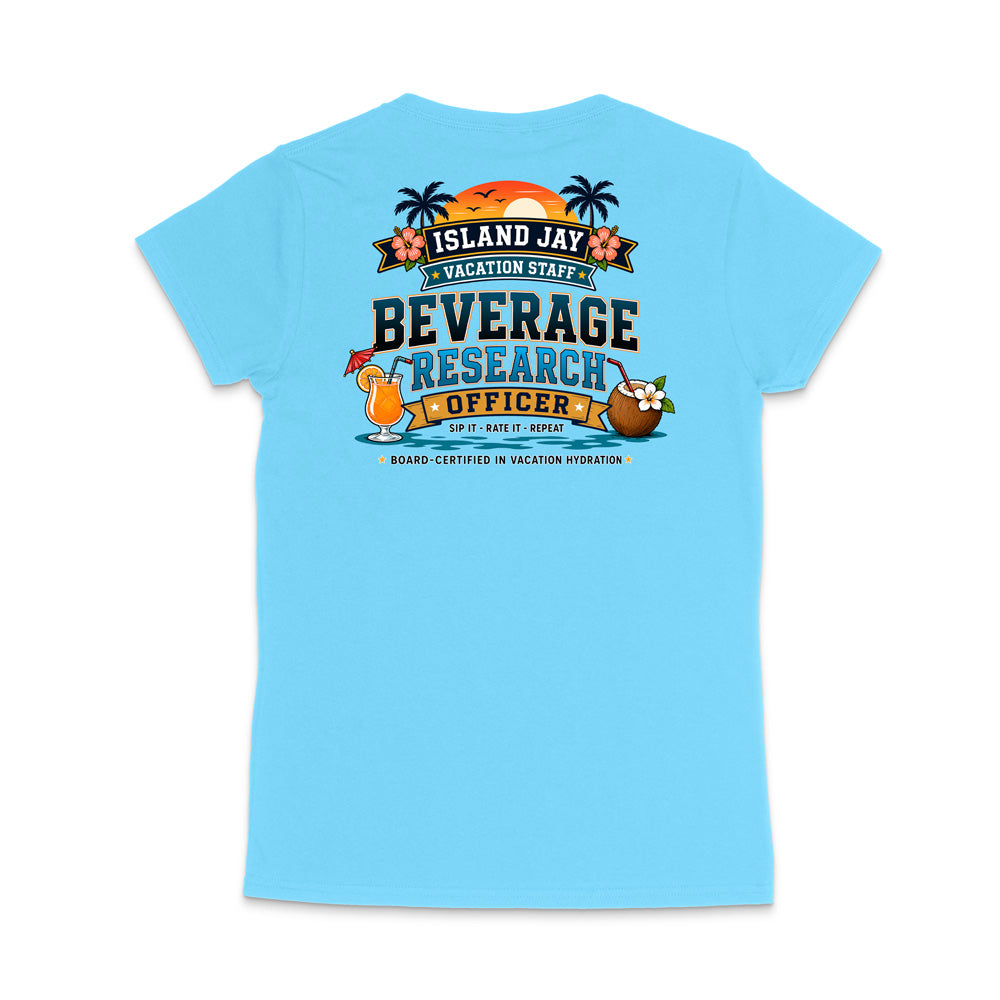 A light blue short-sleeve t-shirt shown from the back, featuring a colorful graphic print with tropical elements and the text 'ISLAND JAY BEVERAGE RESEARCH OFFICER'.