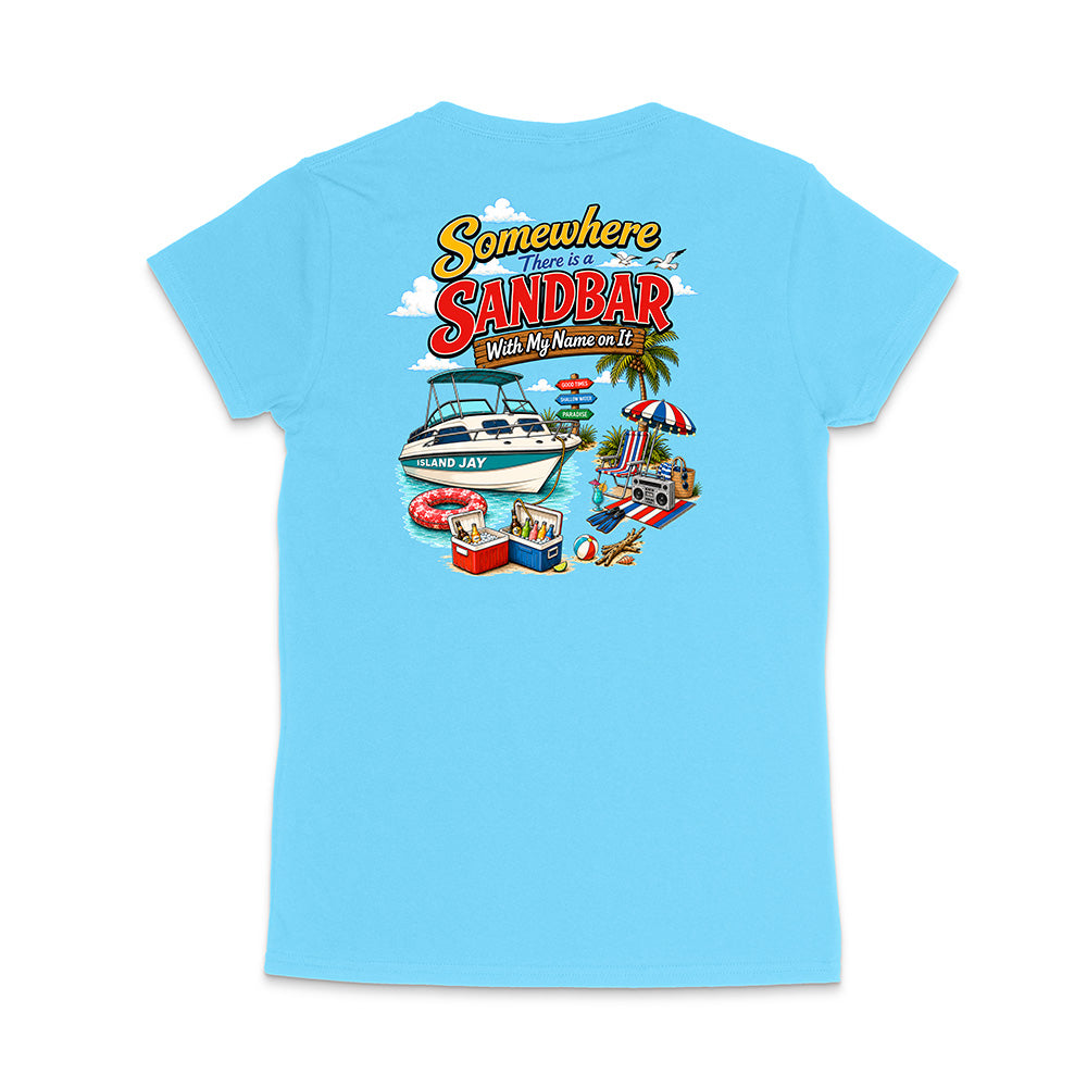 A light blue short-sleeve t-shirt shown from the back, featuring a colorful graphic print with the text 'Somewhere There Is A Sandbar With My Name on It' and beach-themed illustrations including a boat, umbrella, cooler, and palm tree.