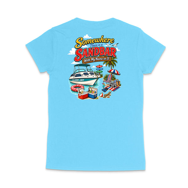 A light blue short-sleeve t-shirt shown from the back, featuring a colorful graphic print with the text 'Somewhere There Is A Sandbar With My Name on It' and beach-themed illustrations including a boat, umbrella, cooler, and palm tree.