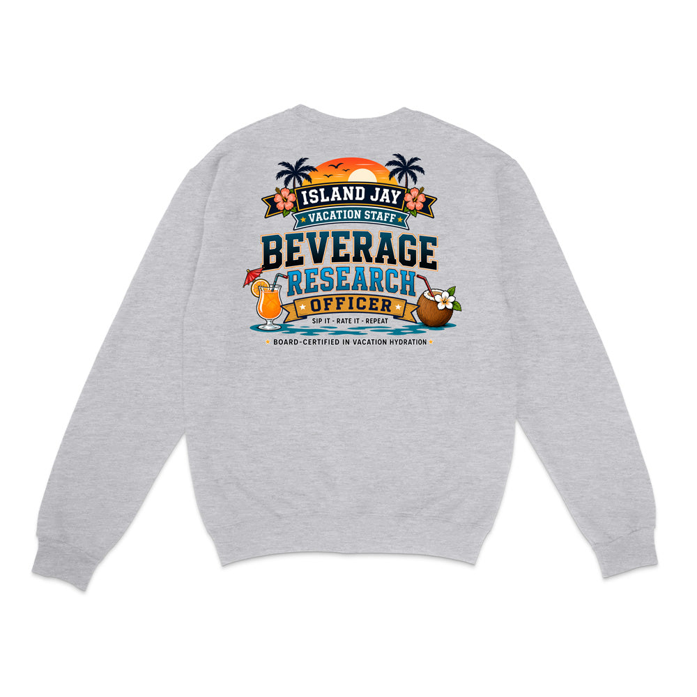 A light heather gray crewneck sweatshirt shown from the back, featuring a colorful graphic print with tropical elements and the text 'ISLAND JAY BEVERAGE RESEARCH OFFICER'.