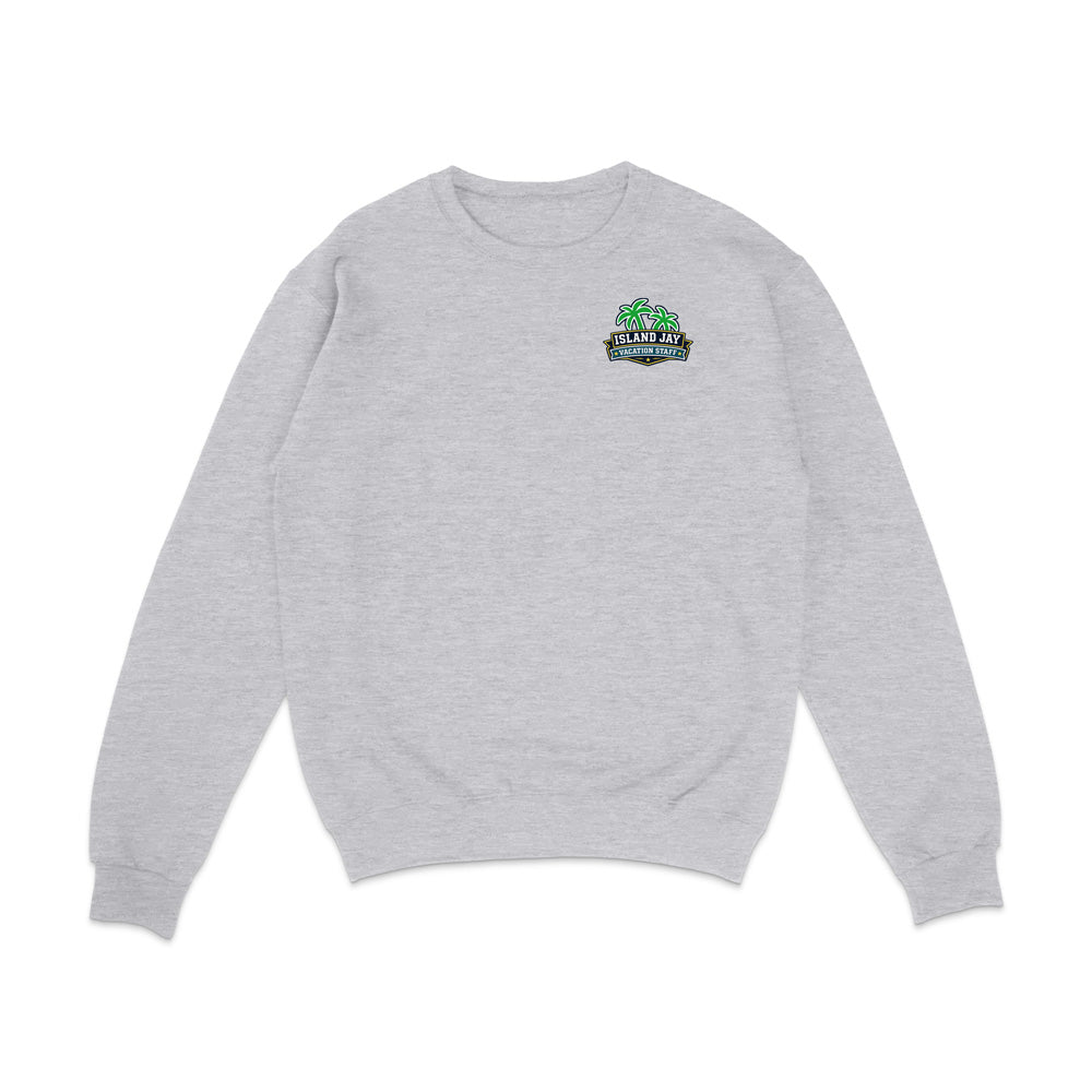 A light heather gray crewneck sweatshirt with a small graphic on the left chest featuring green palm trees and a sign that reads 'SUNSET BEACH'.
