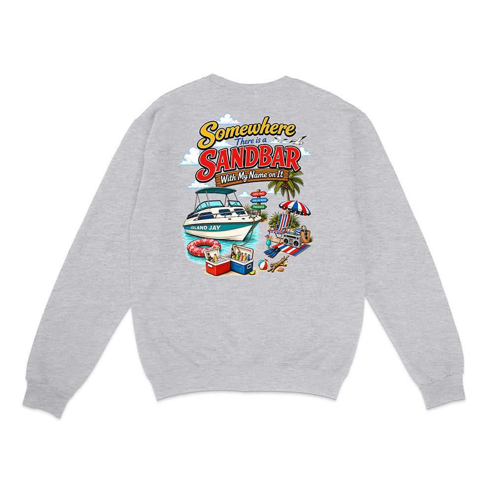 A light heather gray crewneck sweatshirt shown from the back, featuring a colorful graphic print with the text 'Somewhere There is a SANDBAR Make My Name Your Name' and illustrations of a boat, beach umbrella, palm tree, and poolside scene.