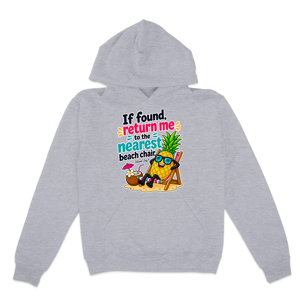 A light heather gray pullover hoodie with a colorful graphic on the chest. The graphic features a pineapple character wearing sunglasses and reclining in a beach chair next to a coconut cocktail, with the text 'If found return me to the nearest beach chair'.