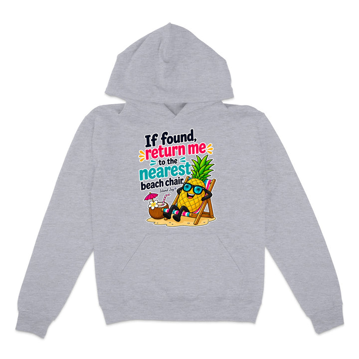 A light heather gray pullover hoodie with a colorful graphic on the chest. The graphic features a pineapple character wearing sunglasses and reclining in a beach chair next to a coconut cocktail, with the text 'If found return me to the nearest beach chair'.