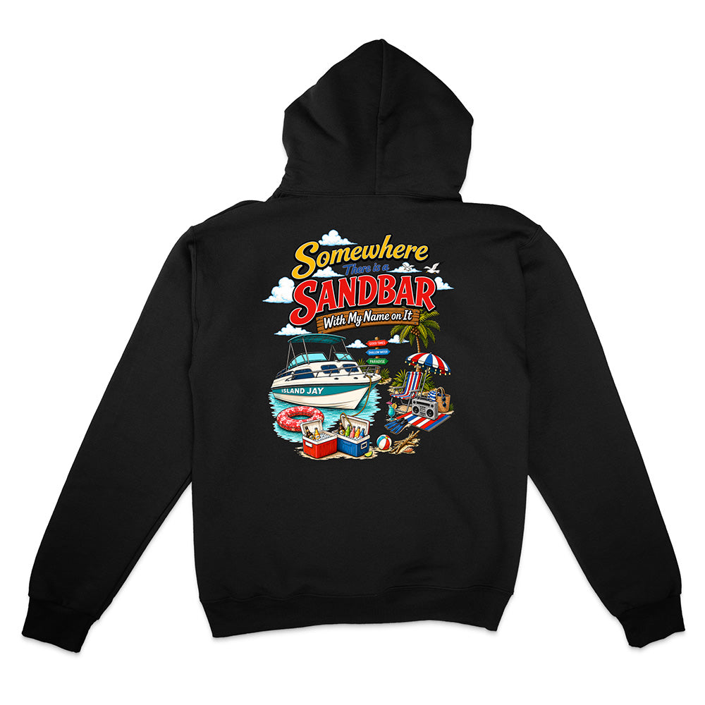 A black pullover hoodie shown from the back, featuring a colorful graphic print with the text 'Somewhere SANDBAR Where My Name Is Kit' above an illustration of a boat, beach umbrella, and beach scene.