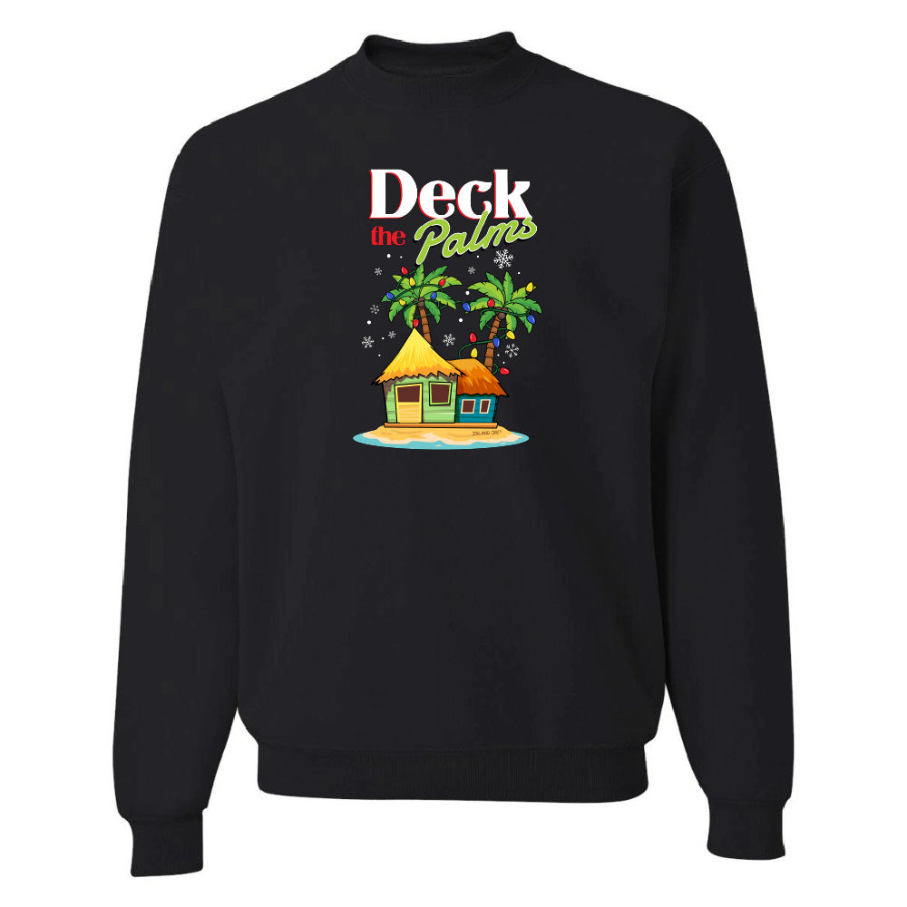 Black sweatshirt with a tropical hut and palm tree design and graphic text reading "Deck The Palms" on a white background