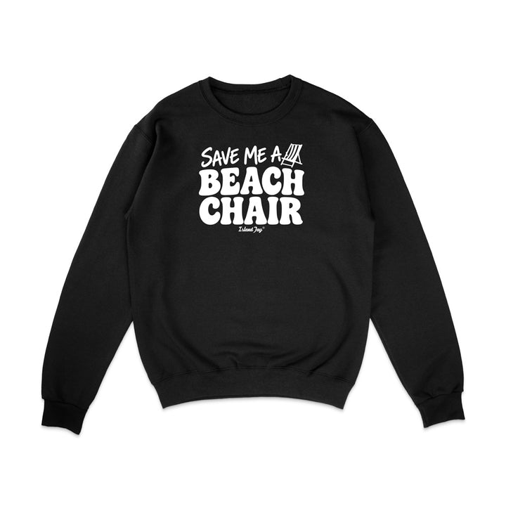 A black crewneck sweatshirt with a white graphic print on the chest that reads 'SAVE ME A BEACH CHAIR' 