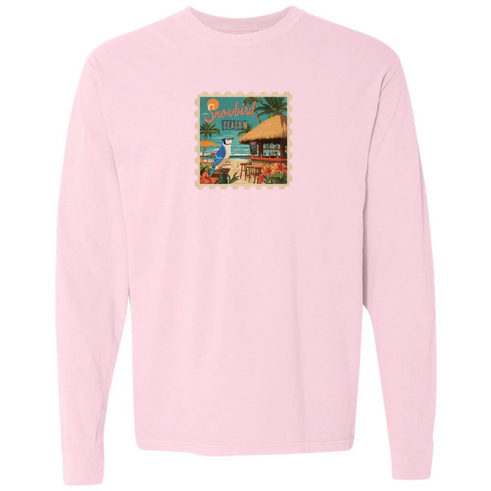Pink sweatshirt with a tropical graphic on a white background