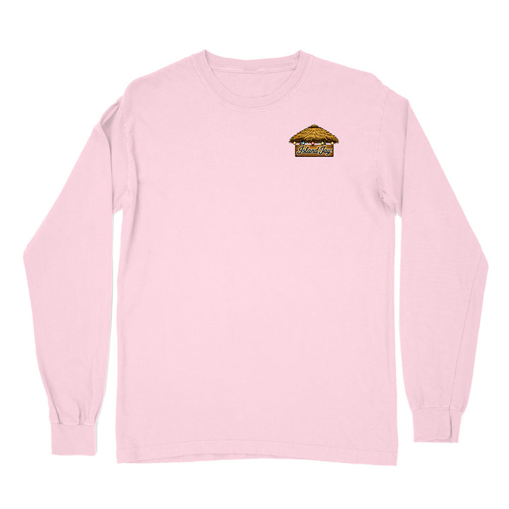 A light pink long-sleeve crewneck t-shirt with a small graphic on the left chest depicting a thatched-roof hut with the text 'Wild West'.