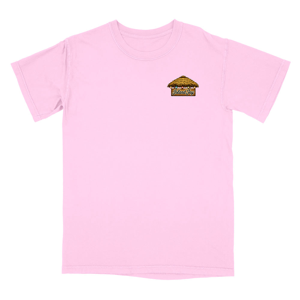 A light pink short-sleeve crewneck t-shirt with a small graphic on the left chest depicting a thatched-roof hut with the text 'WELCOME TO WILMINGTON'.
