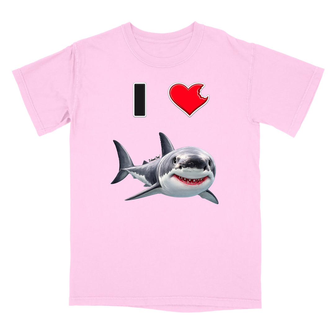 A light pink short-sleeve crewneck t-shirt featuring a graphic print of a great white shark and a red heart with a bite taken out of it, alongside a black vertical bar, on a plain white background.