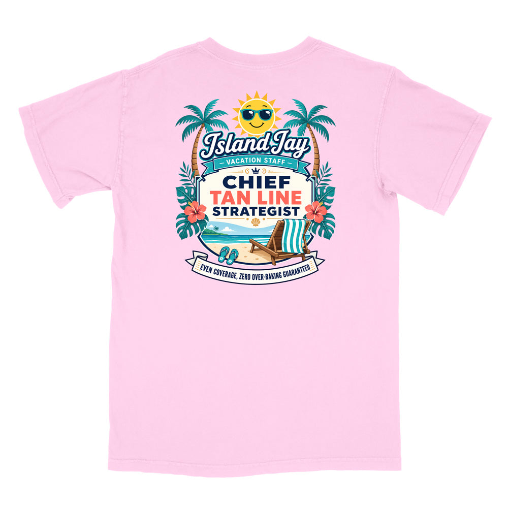 A pink short-sleeve t-shirt with a colorful graphic print on the front. The graphic features a smiling sun wearing sunglasses, palm trees, a beach scene, and text that reads 'Island Jay Vacation Staff by CHIEF TAN LINE STRATEGIST'.