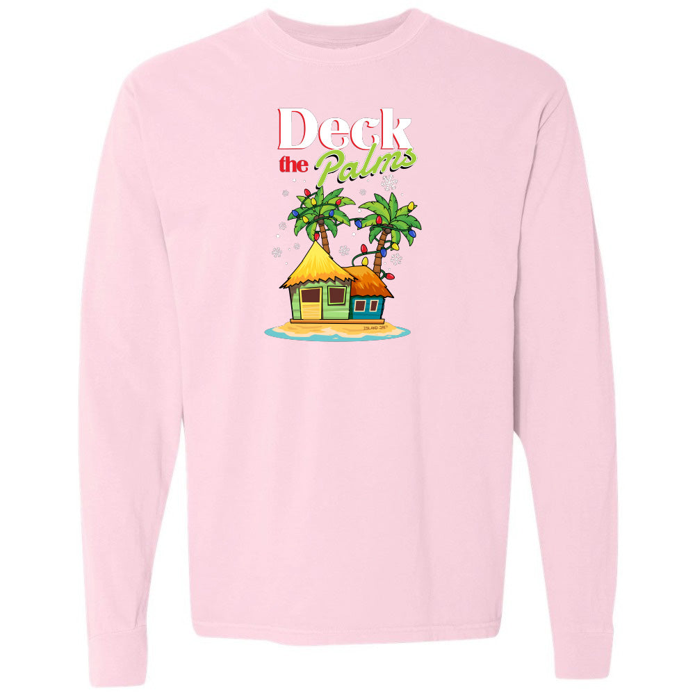 Pink long-sleeve shirt with a tropical hut and palm tree design and graphic text reading "Deck The Palms" on a white background