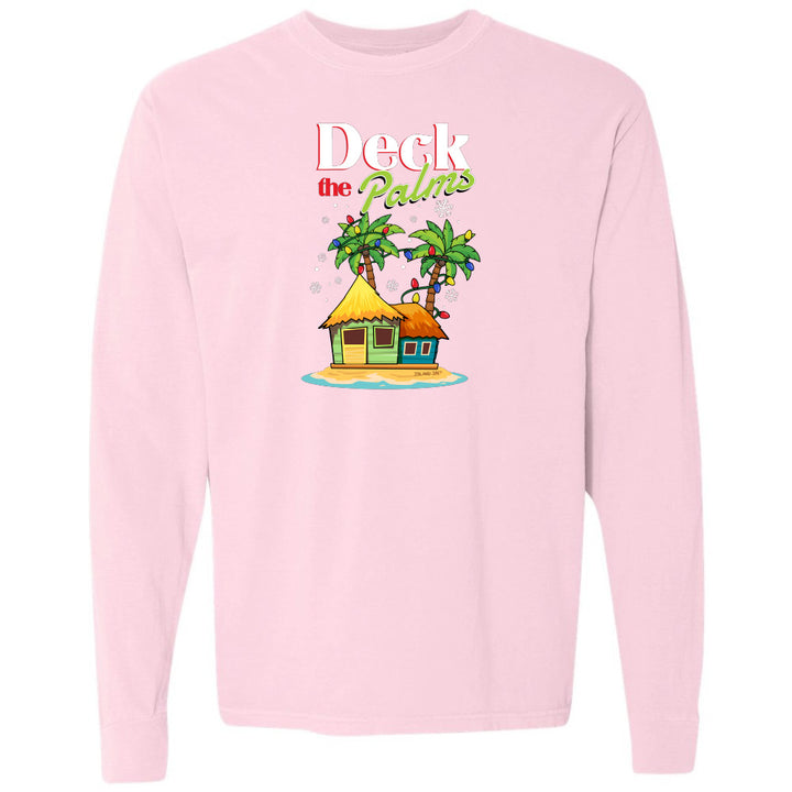 Pink long-sleeve shirt with a tropical hut and palm tree design and graphic text reading "Deck The Palms" on a white background