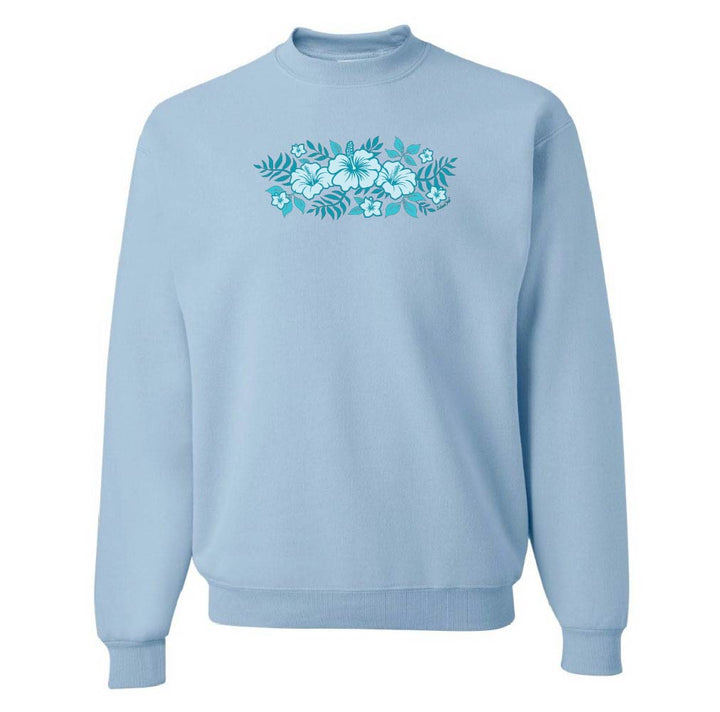 Light blue sweatshirt with teal floral design on a white background