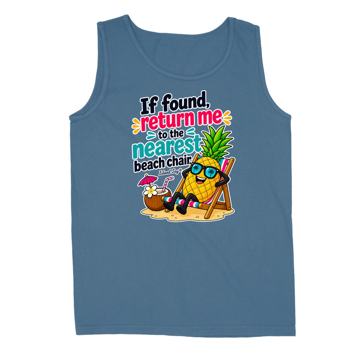 A sleeveless tank top in dusty blue, featuring a colorful graphic of a pineapple character wearing sunglasses and relaxing in a beach chair with the text 'If found, return me to the nearest beach chair'.