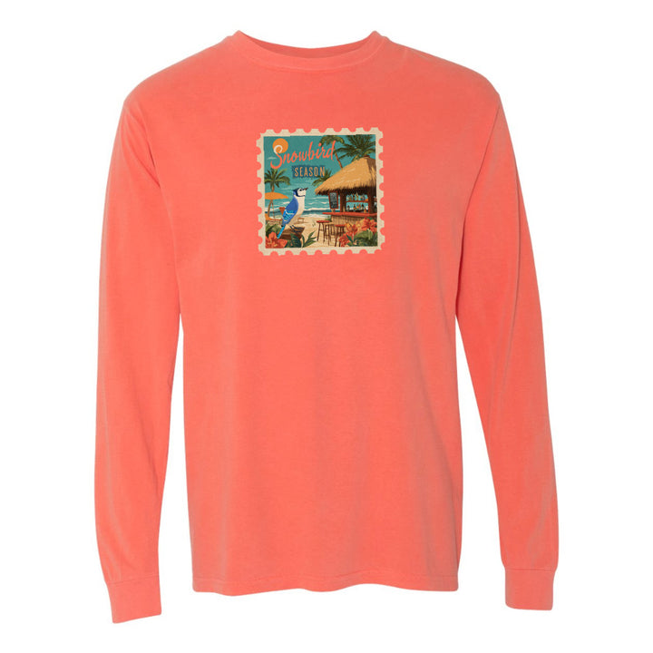 Coral long-sleeve shirt with a colorful graphic on a white background