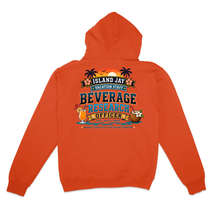 An orange hoodie shown from the back, featuring a colorful graphic print with the text 'ISLAND JAY BEVERAGE RESEARCH OFFICER' and tropical-themed illustrations including palm trees, a cocktail, and a coconut drink.