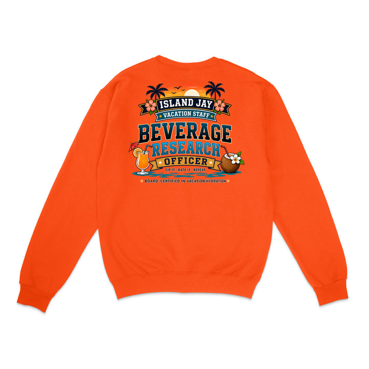 An orange crewneck sweatshirt shown from the back, featuring a colorful graphic print with the text 'ISLAND JAY BEVERAGE RESEARCH OFFICER' and tropical illustrations including palm trees, a cocktail, and a flower.