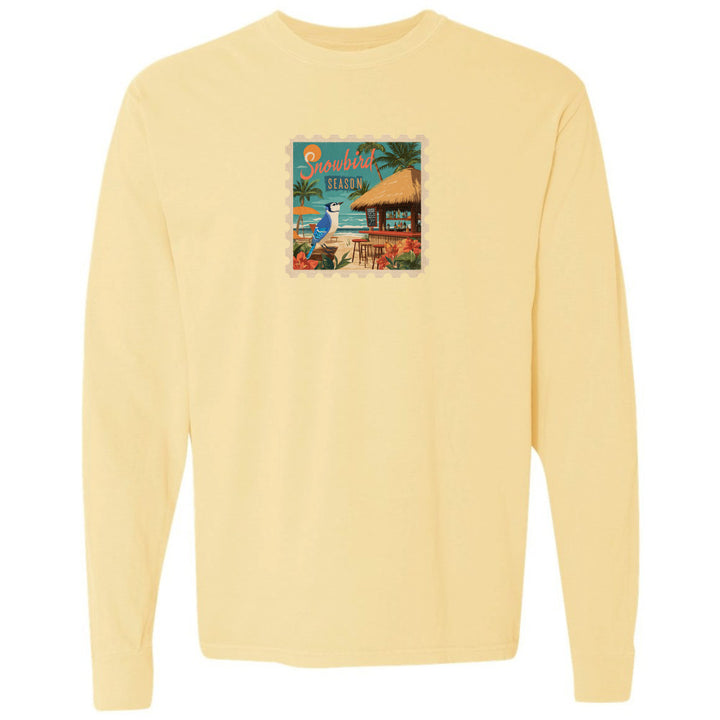 Yellow long-sleeve shirt with a colorful graphic on the chest against a white background