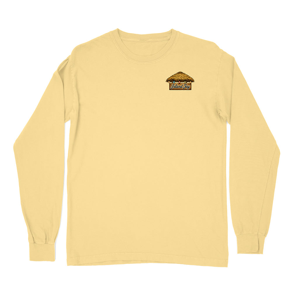 A pale yellow long-sleeve crewneck t-shirt with a small graphic on the left chest depicting a thatched-roof hut with the text 'Wild West'.