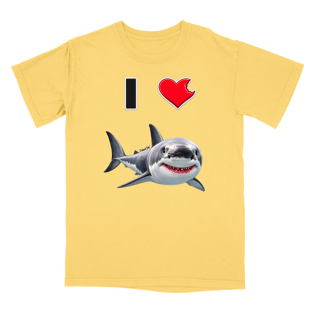 A pale yellow short-sleeve crewneck t-shirt featuring a graphic print of a great white shark and a red heart with a black 'I' on a white background.
